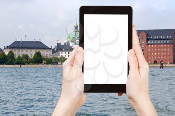travel concept - tourist photograph waterfront, Marble Church and The Royal Cast Collection in Copenhagen, Denmark on tablet pc with cut out screen with blank place for advertising logo