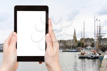 travel concept - tourist photograph view Saint-Malo walled port city in Brittany, France on tablet pc with cut out screen with blank place for advertising logo