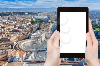 travel concept - tourist photograph panorama of St. Peter Square from roof of St. Peter Basilica, Rome, Italy on tablet pc with cut out screen with blank place for advertising logo