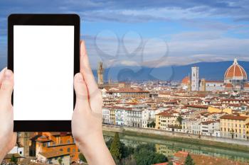 travel concept - tourist photograph skyline of Florence city, Italy from from Michelangelo Park on tablet pc with cut out screen with blank place for advertising logo