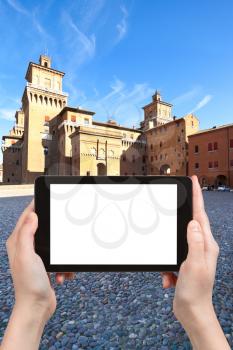 travel concept - tourist photograph stone pavement Piazza Castello in Ferrara city, Italy in autumn on tablet pc with cut out screen with blank place for advertising logo