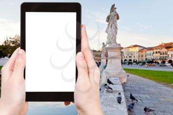 travel concept - tourist photograph square Prato della Valle in Padua, Italy on tablet pc with cut out screen with blank place for advertising logo