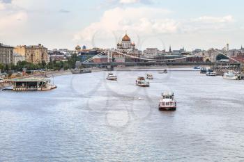 excursion boats in Moskva River near Krymsky Bridge, Moscow, Russia