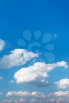 natural background - white clouds in blue afternoon sky in summer