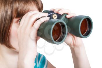 girl looks through field glasses isolated on white background