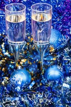 Christmas still life - above view of two glasses of champagne in blue Xmas decorations