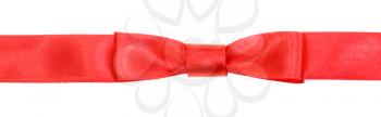 real red bow knot on wide silk ribbon isolated on white background