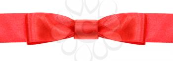 symmetrical red bow knot on wide silk ribbon isolated on white background