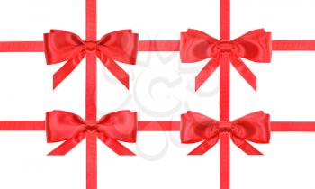 four red satin bows and four intersecting ribbons isolated on horizontal white background