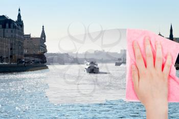travel concept - hand deletes winter view of Moscow River by pink cloth from image and summer cityscape is appearing