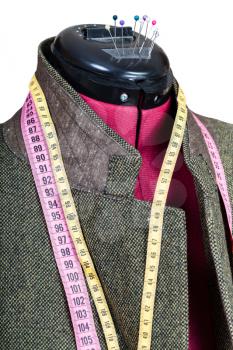 tailoring of man tweed jacket on mannequin isolated on white background