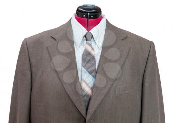 business suit on tailor mannequin - green woolen jacket with shirt and tie close up isolated on white background