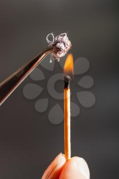 experiment to determine the composition of tissue - match flame ignites cotton tissue sample