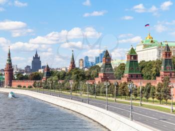 Moscow cityscape - view of Red Walls and Towers of Moscow Kremlin on Kremlin Embankment of Moskva Rive in Moscow, Russia in summer day