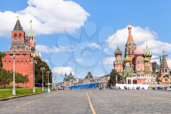 Moscow cityscape - Vasilevsky Descent, Towers of Moscow Kremlin, Saint Basil Cathedral on Red Square of Moscow Kremlin in sunny summer day