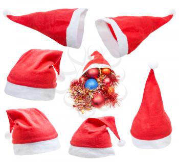 christmas symbol - set of traditional red santa claus hat isolated on white background