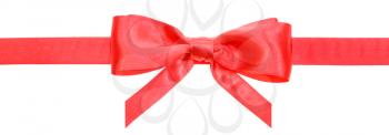 narrow red satin ribbon with real bow with vertical cut ends isolated on white background