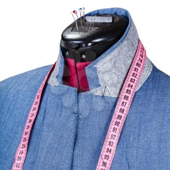 tailoring of man blue jacket on dummy isolated on white background