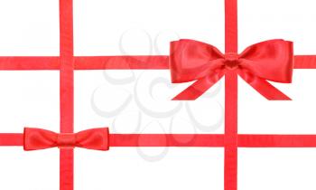 red satin bow and knot and four intersecting ribbons isolated on horizontal white background