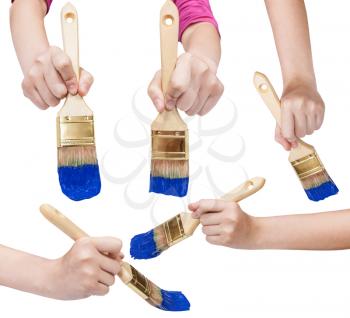 set of painter hands with flat paint brushes with blue painted tips isolated on white background