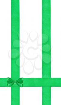 little green bow knot on three vertical satin ribbons isolated on white background