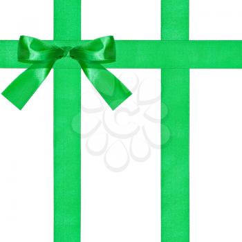 one big green bow knot on three satin ribbons isolated on white background
