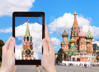 travel concept - tourist photographs picture of Vasilevsky Descent on Red Square in Moscow Kremlin on tablet pc