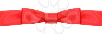 symmetrical red bow knot on wide satin ribbon isolated on white background