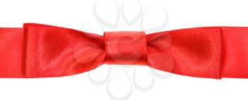 real red bow knot on wide satin tape isolated on white background