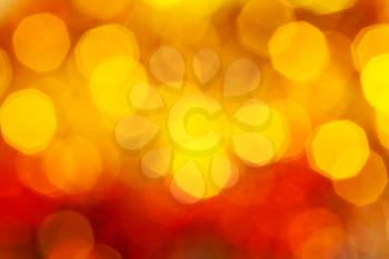 abstract blurred background - big red and yellow twinkling Xmas lights bokeh of garlands on Christmas tree