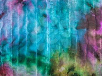 textile background from abstract painted stitched silk batik