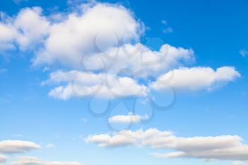 natural background - white clouds in blue sky in autumn sunny day
