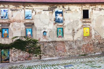 travel to Bratislava city - abandoned house of the 17th century with mural paintings in windows at Rudnayovo namestie (square) in Bratislava