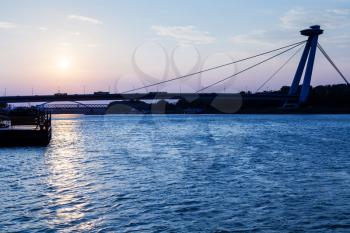 travel to Bratislava city - view of New bridge across Danube river at blue dawn