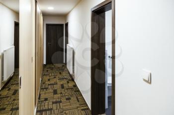 narrow corridor with built-in mirror wardrobe