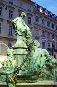 travel to Vienna city - Enns boatman figure in Donnerbrunnen fountain at Neuer Markt square in Vienna, Austria