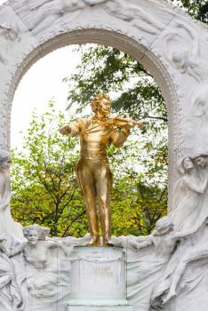 travel to Vienna city - gilded bronze monument of Waltz King Johann Strauss son in Stadtpark (City Park) Vienna, Austria