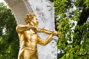 travel to Vienna city - golden statue Johann Strauss close up in Stadtpark (City Park) Vienna, Austria