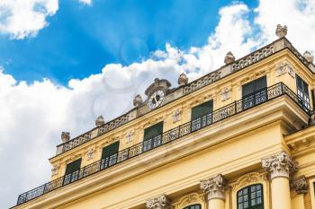 travel to Vienna city - facade of Schloss Schonbrunn palace and white cloud in blue sky, Vienna, Austria
