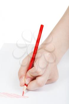 hand drafts by red pencil on sheet of paper isolated on white background