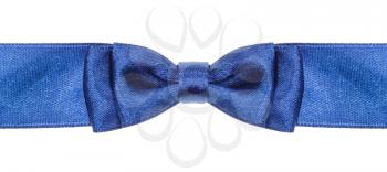 symmetric blue bow knot on wide satin ribbon isolated on white background