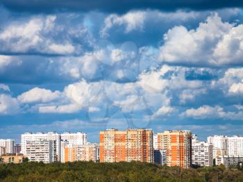 heavy low blue clouds over residential quarter in summer