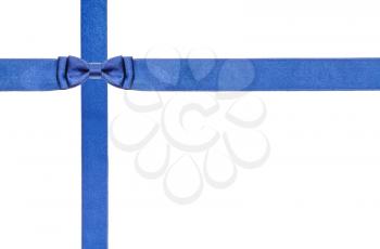 one blue satin bow knot in upper left corner and two intersecting ribbons isolated on horizontal white background