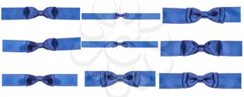 set of blue bow knots on satin ribbons isolated on white background