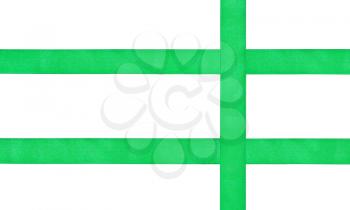 three crossing green silk ribbons isolated on white background