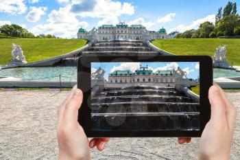 travel concept - tourist snapshot of upper fountain cascade in Belvedere palace garden in Vienna on tablet pc