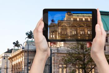 travel concept - tourist snapshot of State Opera House in Vienna on tablet pc