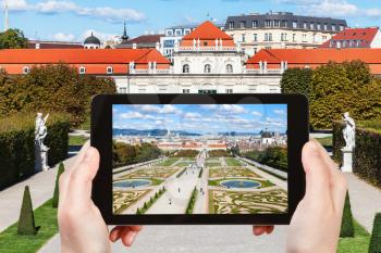 travel concept - tourist snapshot of garden and Lower Belvedere Palace in Vienna on tablet pc