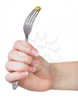 hand holding dinning fork with impaled green pea isolated on white background