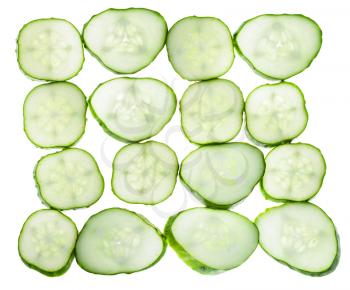 many slices of fresh cucumber isolated on white background